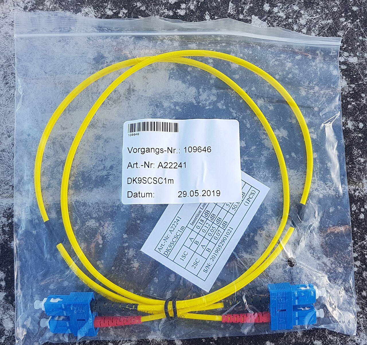 Optical fibre patch cables plugged into connectors