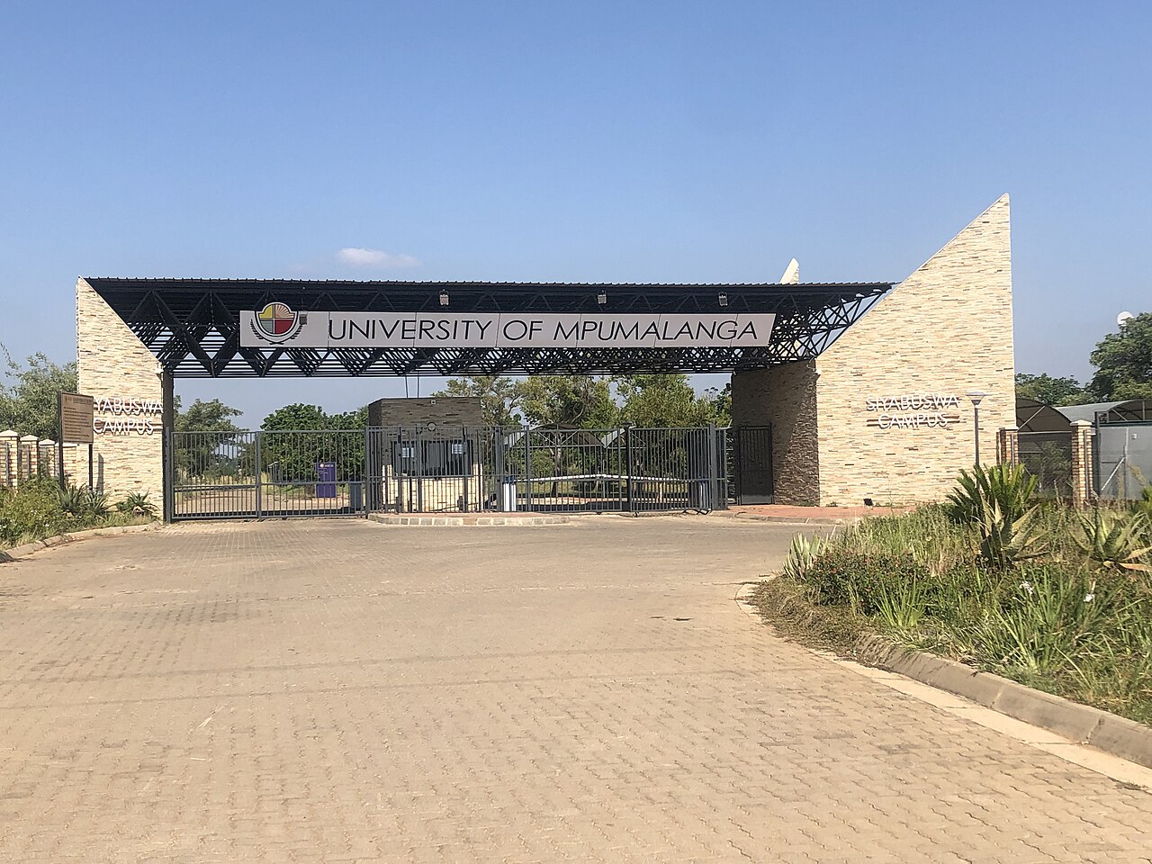 Main gate of the University of Mpumalanga's Siyabuswa Campus under a clear blue sky